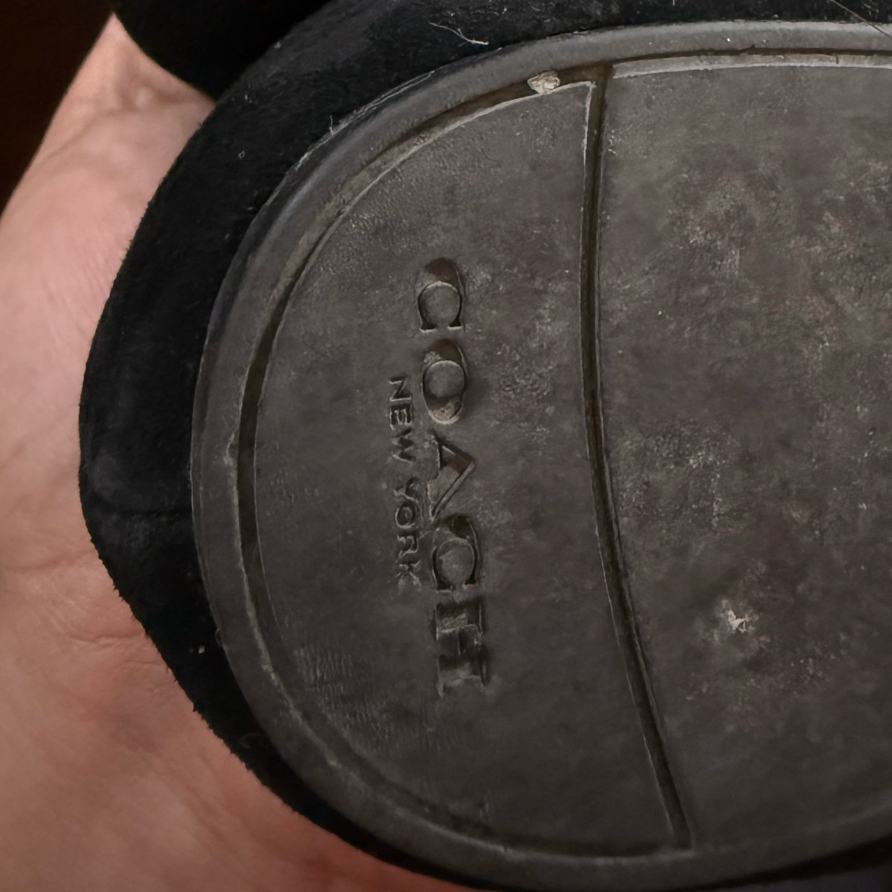 Closed-toe flat shoes (Coach New York).